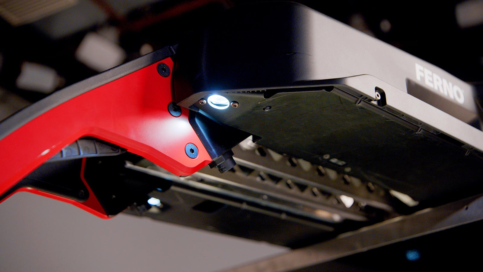 Close-up of the Ferno Power F2 SceneBright LED lights below the carriage